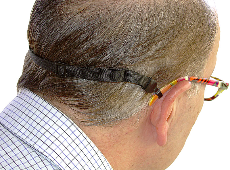Person wearing glasses secured by a Glass-Gard holder